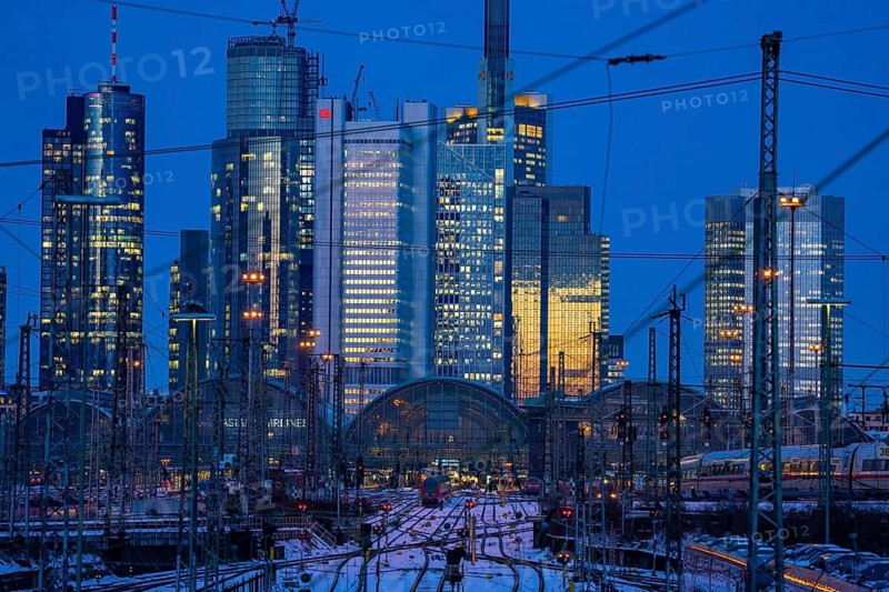 Railway tracks in front of the main station of Frankfurt am Main, ICE train, skyline of the skyscrapers in the Cit, winter, snow, dusk, Hesse, North Rhine-Westphalia