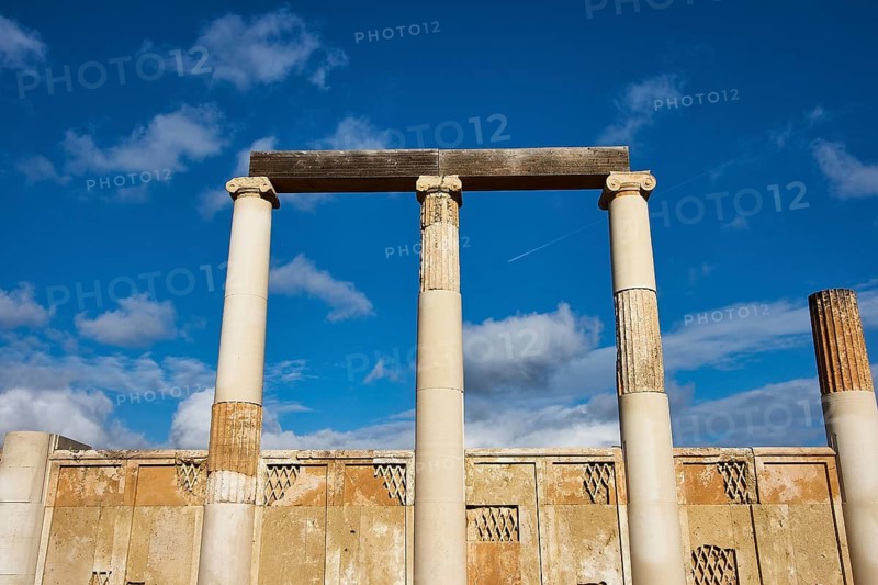 Ancient columns under a cloudless blue sky, a picture of classical architecture, Ancient Temple, Epidaurus, Peloponnese, Greece