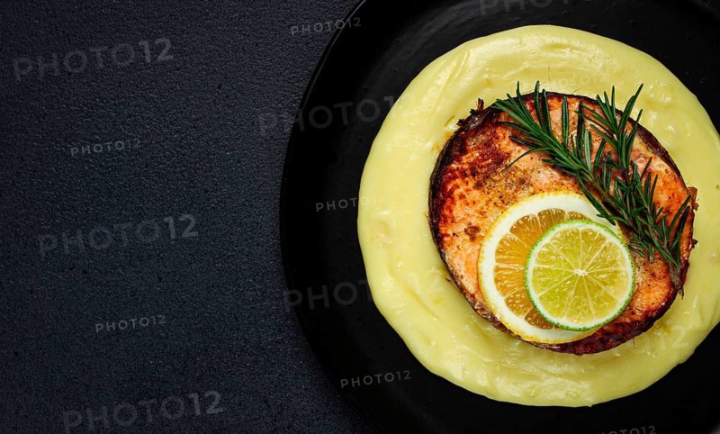Salmon steak, fried, mashed potatoes, top view, rosemary, lemon and lime, homemade, one serving, no people