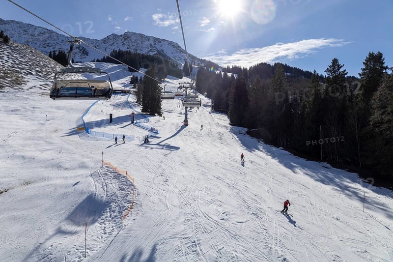Sun and good snow conditions in the Oberjoch ski area in the Allgäu region. View of the slopes from the chairlift