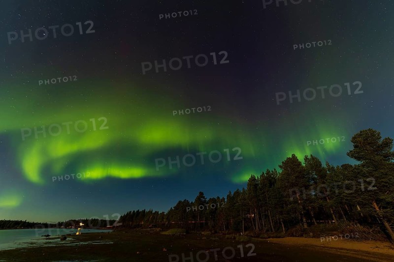 Northern lights, (Aurora borealis) at a lake near Kiruna, September 2024, Lapland, Sweden