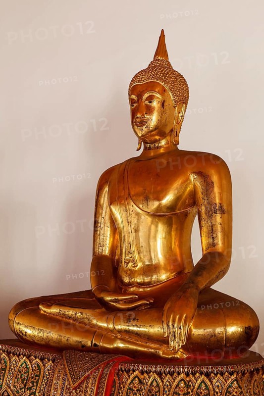 Sitting Buddha Gold Statue close up in Buddhist Temple. Wat Pho, Bangkok, Thailand