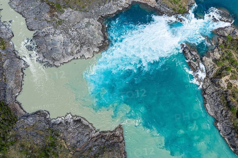 Confluence of river Rio Baker and Rio Neff, aerial view, muddy water of Rio Neff merges with glacial stream Rio Baker, Patagonia, Chile