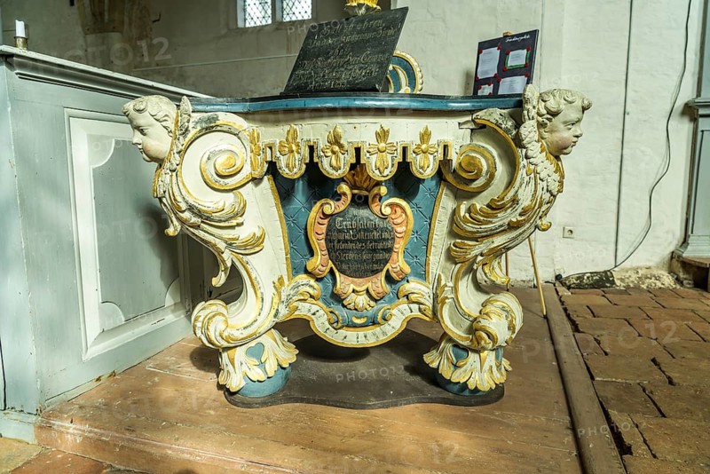 Baptismal font in the interior of St Catherine's Church in Trent, Ruegen Island, Mecklenburg-Western Pomerania, Germany