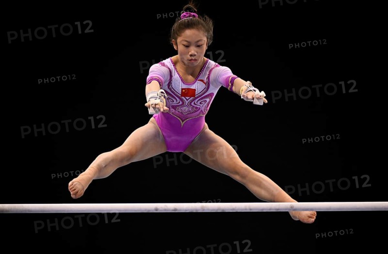 Guying Xie CHN uneven bars action gymnastics, EnBW DTB-Pokal, Porsche-Arena, Stuttgart, Baden-Württemberg, Germany