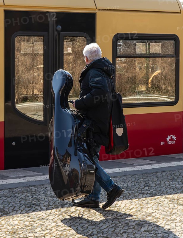 S-Bahn platform with passengers and the historic structures at Lichterfelde West station, Berlin, Germany