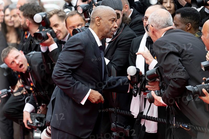 Cannes, France - 19.5.2024: Denzel Washington talks to photographers during the - Highest 2 Lowest - Red Carpet during the 78th Cannes International Film Festival. The film festival takes place from 13 to 24 May 2025