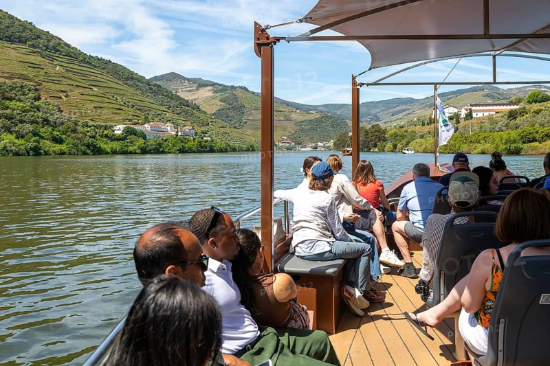 People passengers on rabelo boat trip River Douro valley, near Pinhao, Alto Douro, Portugal