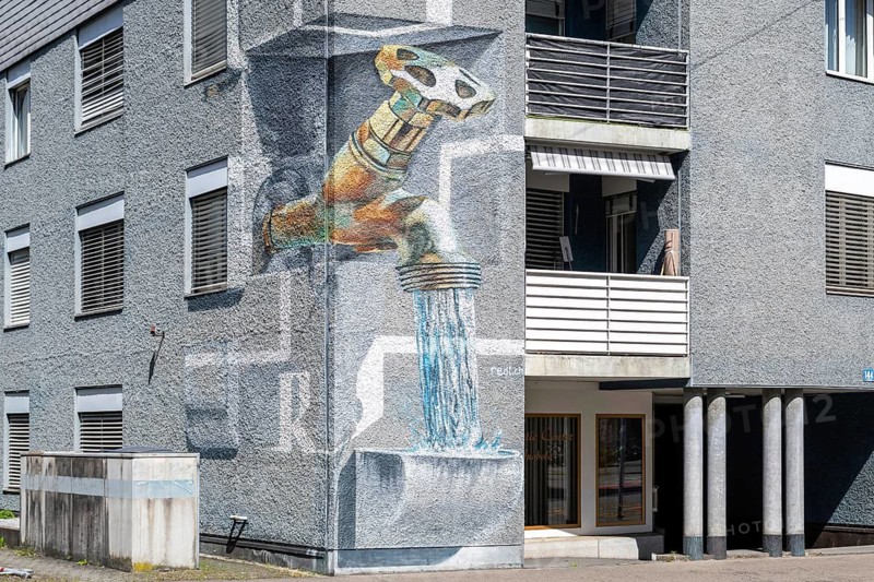 Apartment block wall painting tap