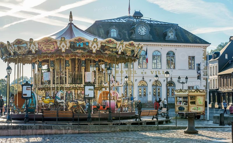 Historic carousel with Hotel de Ville Honfleur France