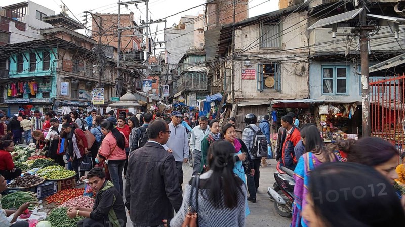 Crowd packed at a street market, vendors offering their goods, Kathmandu, Nepal