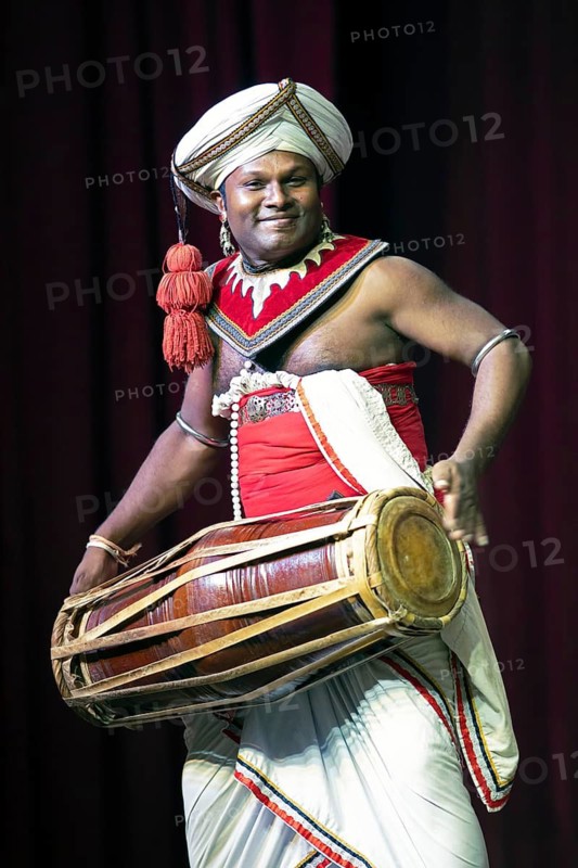 Sri Lankan musician with a traditional drum, Young Men's Buddhist Association, Kandy, Central Province, Sri Lanka