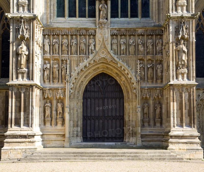 Stone statues around wooden doors Beverley minster, Yorkshire, England, United Kingdom