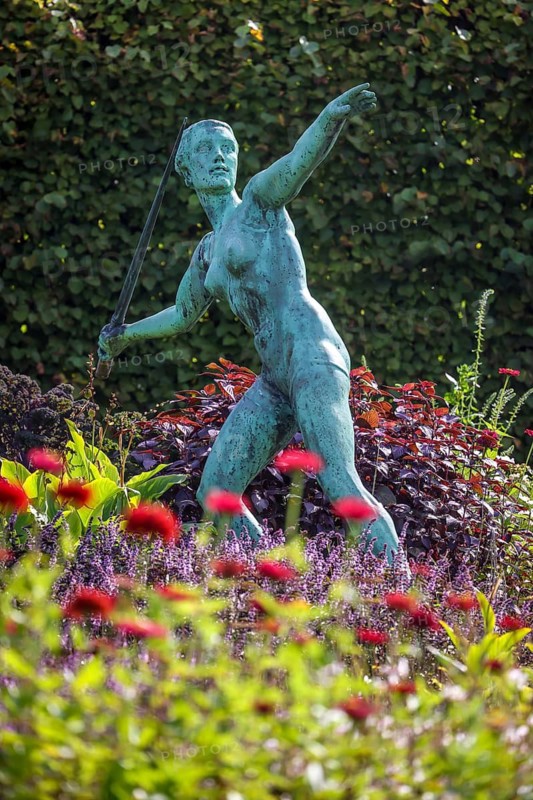 Essen, North Rhine-Westphalia, Germany - Grugapark, a park in Essen, emerged from the first Great Ruhrland Horticultural Exhibition in 1929 and was the park site of the 1965 Federal Garden Show. The park contains more than forty sculptures by important sculptors, here in the perennial garden Spear Thrower by Ernst Seger (1937)
