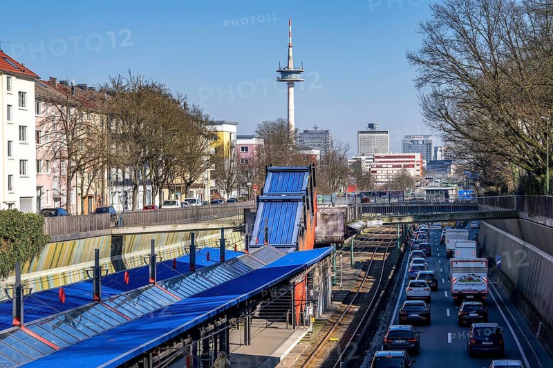Motorway A40, Ruhr expressway, heavy traffic jam, rush hour, city passage in Essen, skyline of the city centre, underground line between the lanes, Breslauer Straße stop, North Rhine-Westphalia, Germany