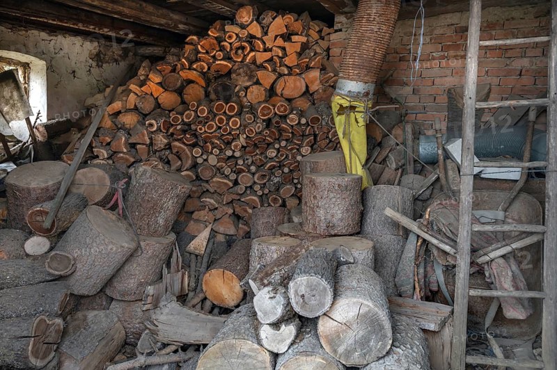 Stored firewood in an outbuilding on a farm, Bavaria, Germany