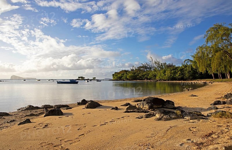 Golden sandy beach on the Indian Ocean near Calodyne, with the island of Gunner's Coin in the background, Riviere du Rempart district, Mauritius