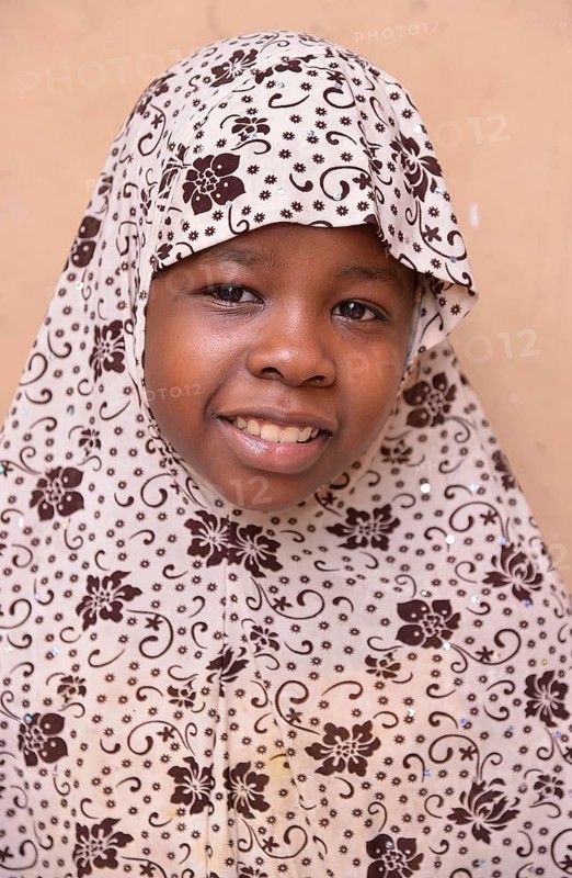 Girl wearing a headscarf, Stone Town, Zanzibar City, Zanzibar, Tanzania
