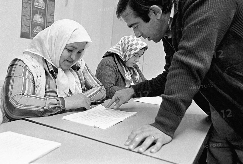 Turkish woman learn the alphabet in a language course, Gelsenkirchen, Germany