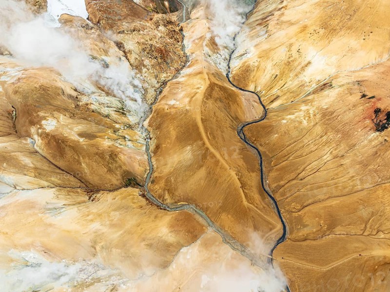 Steaming hot springs and colourful rhyolite mountains, aerial view, Hveradalir geothermal area, Kerlingarfjöll, Icelandic highlands, Iceland