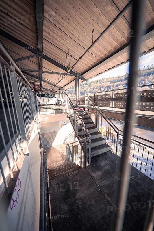 Staircase in a car park with railings and light from outside, Kaufland Calw multi-storey car park, Calw district, Black Forest, Germany