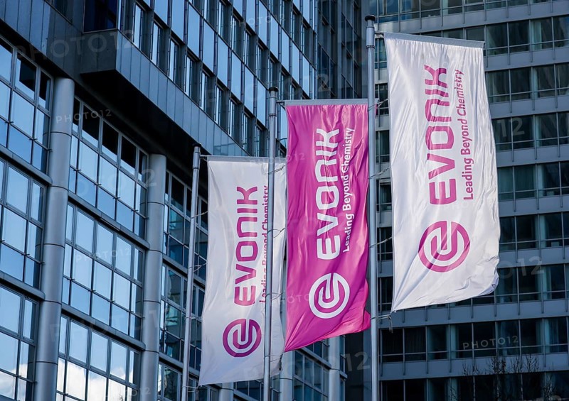 Essen, North Rhine-Westphalia, Germany - Evonik, flags fluttering on the flagpole in front of the headquarters building