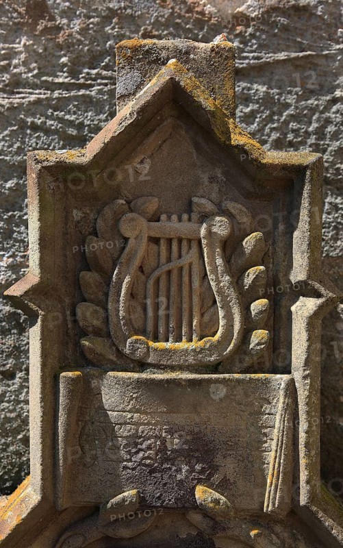 Gravestone at the Evangelical Lutheran Church of St. Andreas in Ummerstadt, district of Hildburghausen, the core of which dates from the 6th to 8th century. The building is the oldest fortified church in the Free State of Thuringia, Germany
