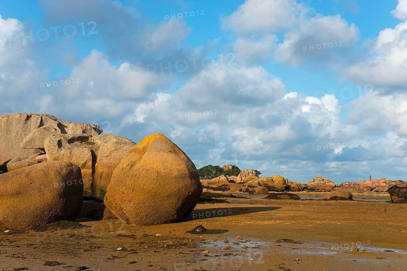 Large rocks under a partly cloudy sky on the coastal beach, Baie de Sainte-Anne, Trégastel, Tregastel, Côte d'Armor, Brittany, France