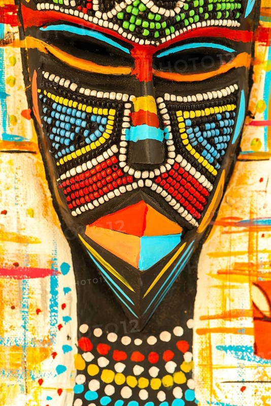 Ghanaian woman as a three-dimensional work of art by a Ghanaian artist, a colourful work of art on canvas, upper part with abstract painting, face mask with artificial pearls, dress made of individual textiles, Ghana