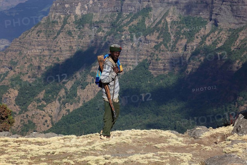 In the highlands of Abyssinia, in the Semien Mountains, landscape in the Semien Mountains National Park, guard, accompanying person, Ethiopia
