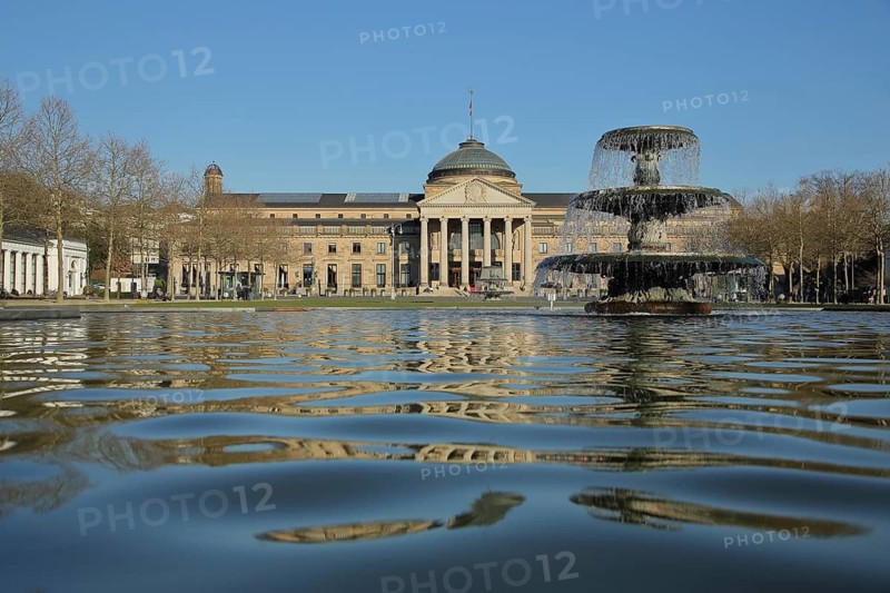 Water pool with fountain and neoclassical spa hotel, view from below, perspective, water, casino, bowling green, Wiesbaden, Taunus, Hesse, Germany