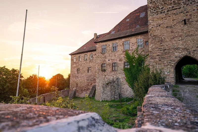 Historic castle with stone walls in the light of the sunset, Allstedt, Harz, Germany