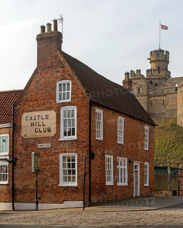 Castle Hill Club on Castle Hill, Drury Lane, city of Lincoln, Lincolnshire, England, UK view to Observatory Tower of castle