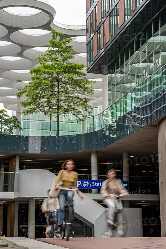 Entrance and exit of the bicycle car park at Utrecht Centraal station, Stationsplein, over 13, 000 parking spaces, considered the largest bicycle car park in the world, over 3 underground floors, Utrecht, Netherlands
