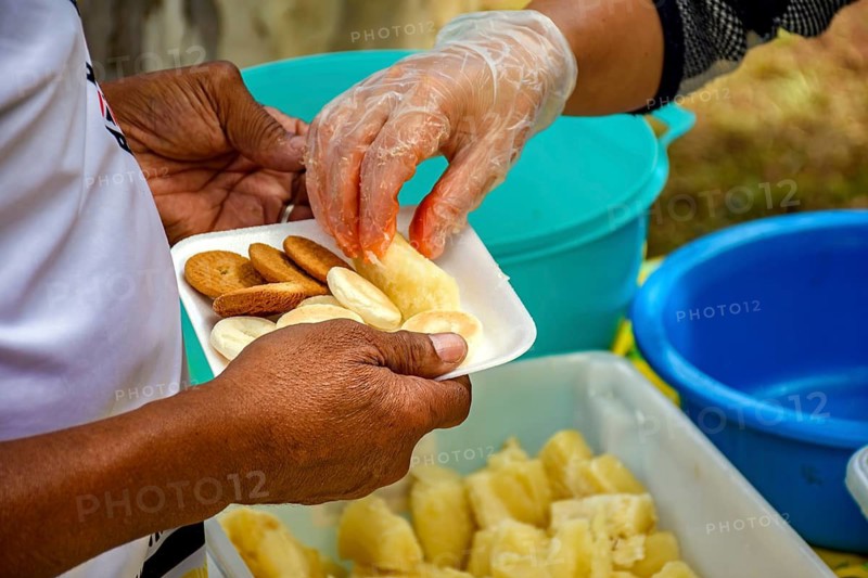 Person receiving food at a community breakfast Belo Horizonte, Minas Gerias, Brazil