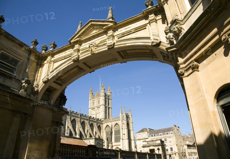 Abbey viewed under arch with deep blue sky, Bath, Somerset, England, UK