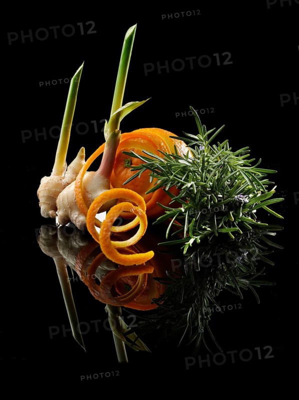 Ginger tubers, orange, orange peel, rosemary on black background, decoration, studio shot