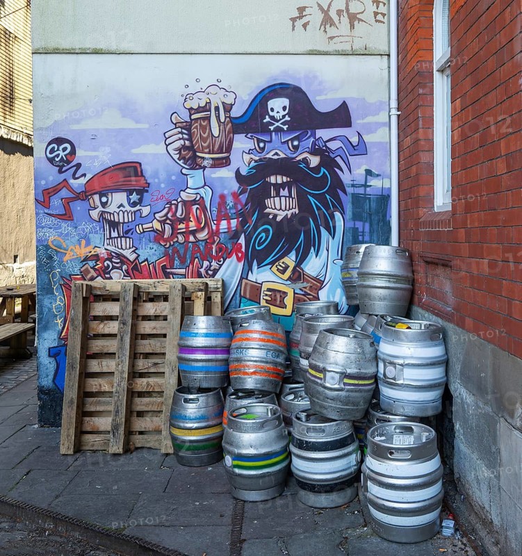 Beer barrels and pirate mural on wall of Seven Stars Inn pub, Redcliffe, Bristol, England, UK