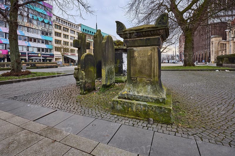 Historic gravestones, general architecture, pavement made of cobblestones and paving slabs, diffuse light, cloudy, Goseriede street, Hanover, state capital, Hanover region, Lower Saxony, Germany