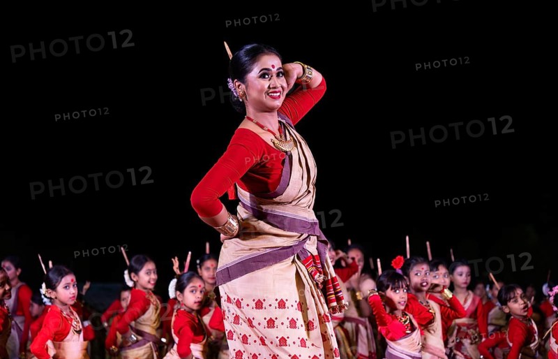 An instructor dance as participants follows the dance step in a Bihu dance workshop ahead of Rongali Bihu Festival, in Guwahati, India on 8 April 2025
