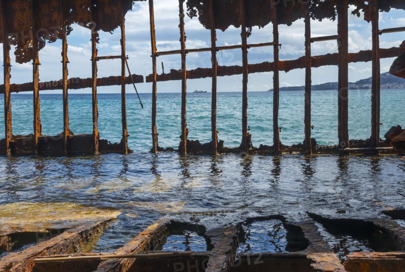 Rusty shipwreck standing half in the water, view through the crumbling structure to the sea, Dimitrios shipwreck, Glyfada beach, Selinitsa, Gythio, Githio, Gythion, Mani, Laconia, Peloponnese, Greece