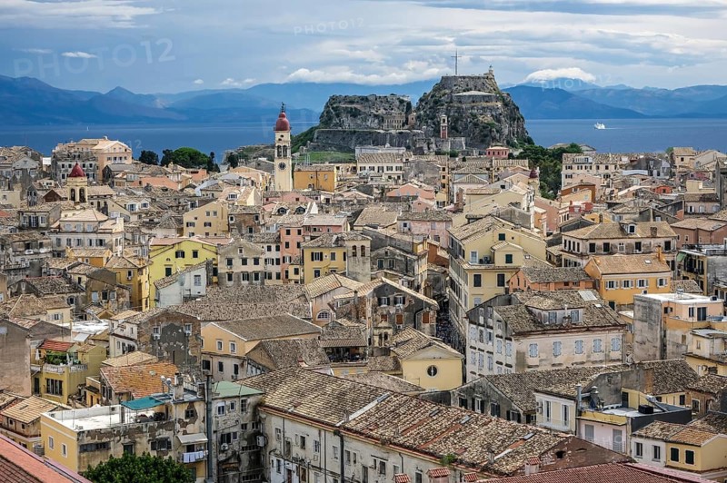 Corfu Town, Corfu, Greece, City overview Corfu Town with the Greek Orthodox Church of Agios Spiridon and the New Fortress. Back mainland Albania