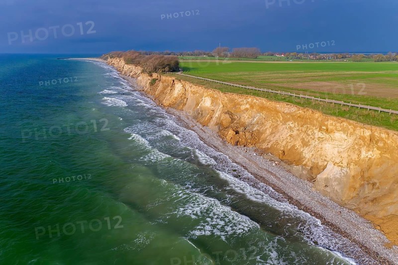 Aerial view over sea cliffs and crumbling shoreline near Wustrow on the Fischland peninsula along the Baltic Sea, Mecklenburg-Vorpommern, Germany