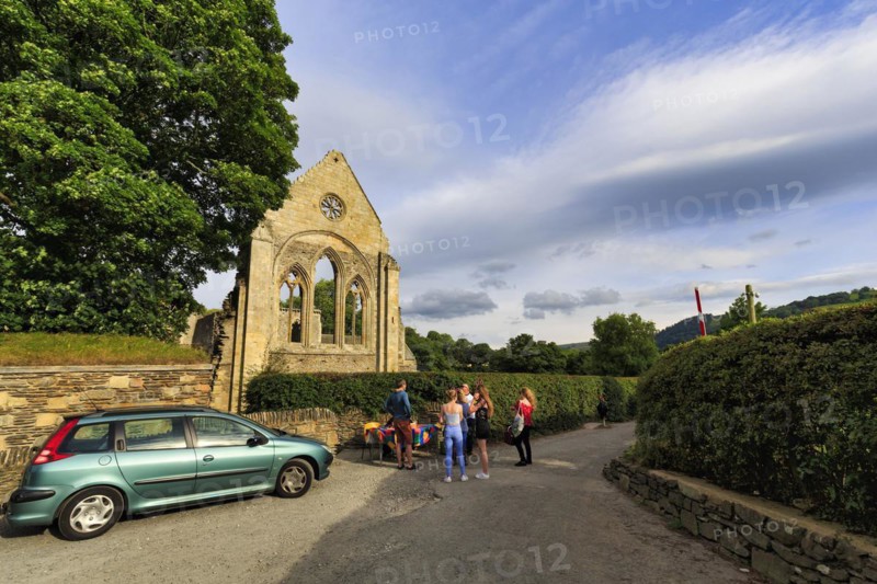 Visitors in front of an open-air concert in the evening, ruin, Abbey Farm, Llangollen, North Wales, Wales, Great Britain