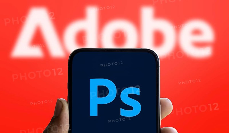 Adobe photoshop logo is displayed on smartphone. Adobe Photoshop is a raster graphics editor developed by Adobe