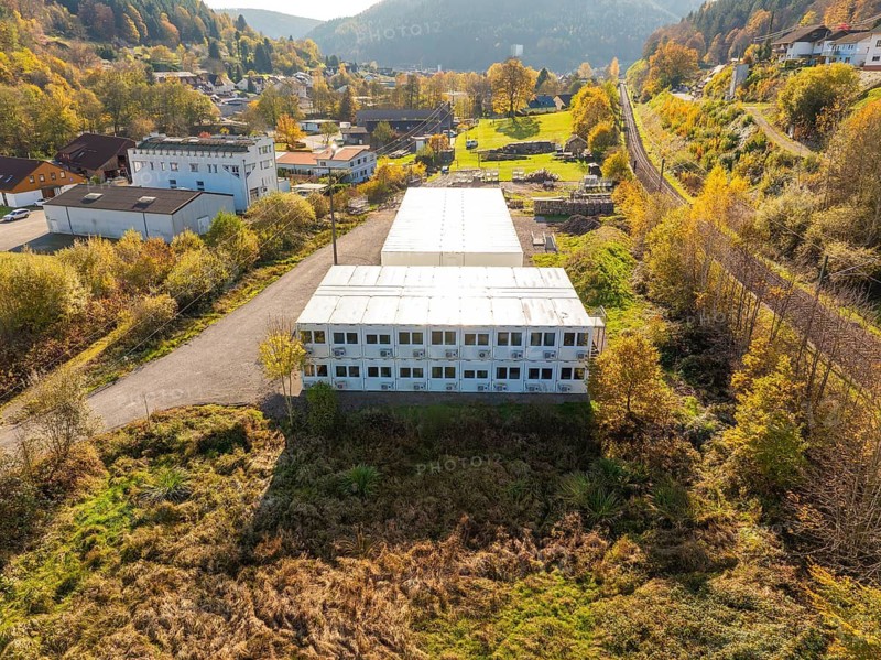 Bird's eye view of industrial building in autumn landscape, refugee accommodation Beermiß, Calmbach, Black Forest, Germany
