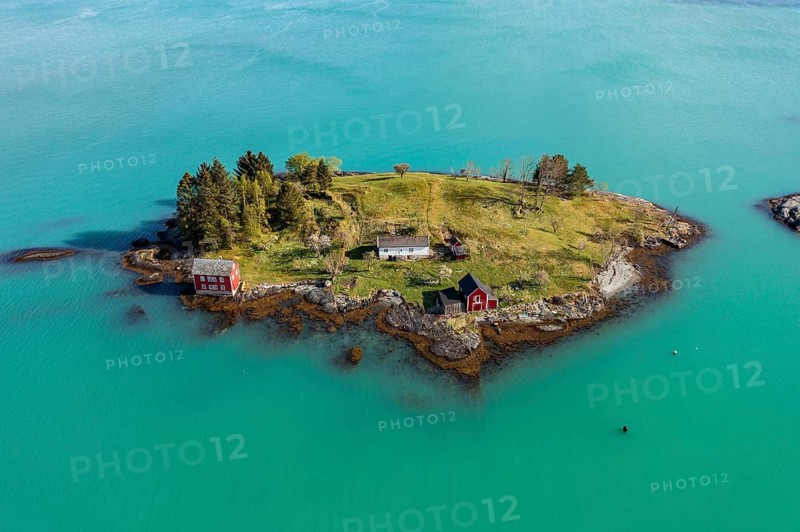 Aerial view of typical red houses on an island in the Hardangerfjord, near Strandebarm, Hordaland, Norway