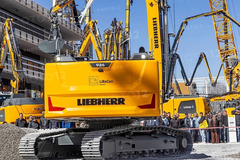 BAUMA Munich, 34th World's Leading Trade Fair for Construction Machinery, Building Material Machines, Mining Machines, Construction Vehicles and Construction Equipment. BAUMA is the world's largest trade fair in terms of exhibition space. Presentation of the German manufacturer Liebherr. Autonomous and electrically powered construction vehicles. Munich, Bavaria, Germany