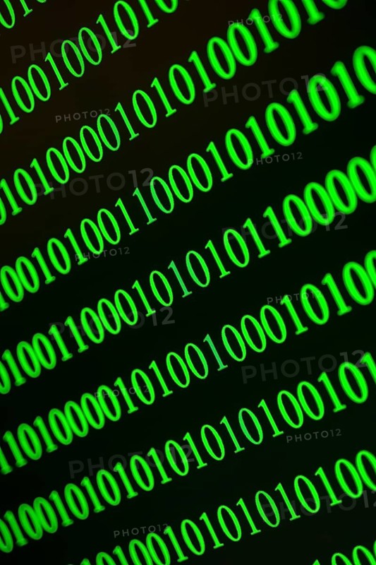 Green binary numbers displayed blurred and fast, conveys digital data