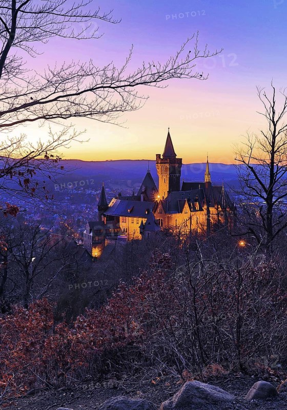Atmospheric view of the illuminated Wernigerode Castle in the evening, Harz Mountains, Saxony-Anhalt, Germany